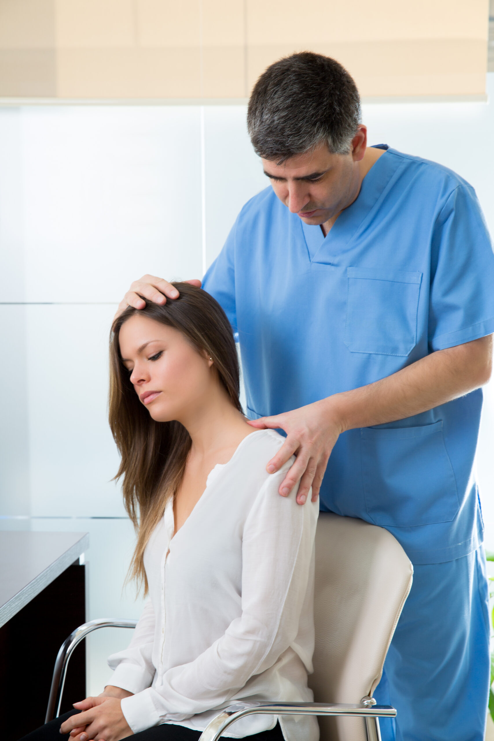 physiotherapist doing myofascial therapy on woman patient