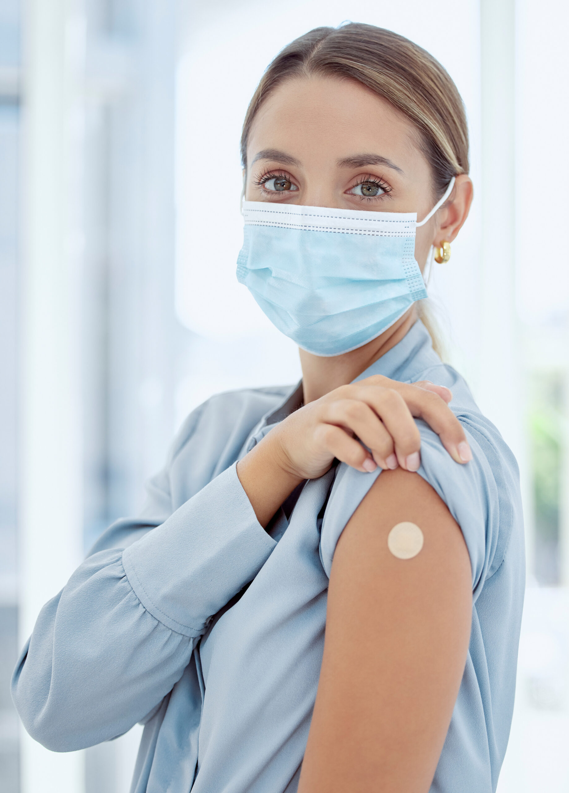 woman-with-plaster-arm-from-covid-vaccine-mask-medical-injection-corona-virus-immune-system-wellness-clinic-healthcare-female-patient-with-flu-vaccination-treatment-risk
